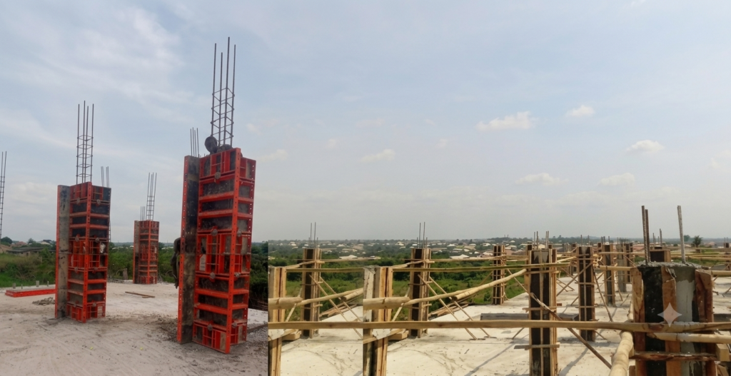 Wide-angle view of a civil engineering construction site showing heavy-duty red steel formwork for concrete pillars on a concrete slab foundation alongside rows of cured structural columns with wooden scaffolding under a blue sky